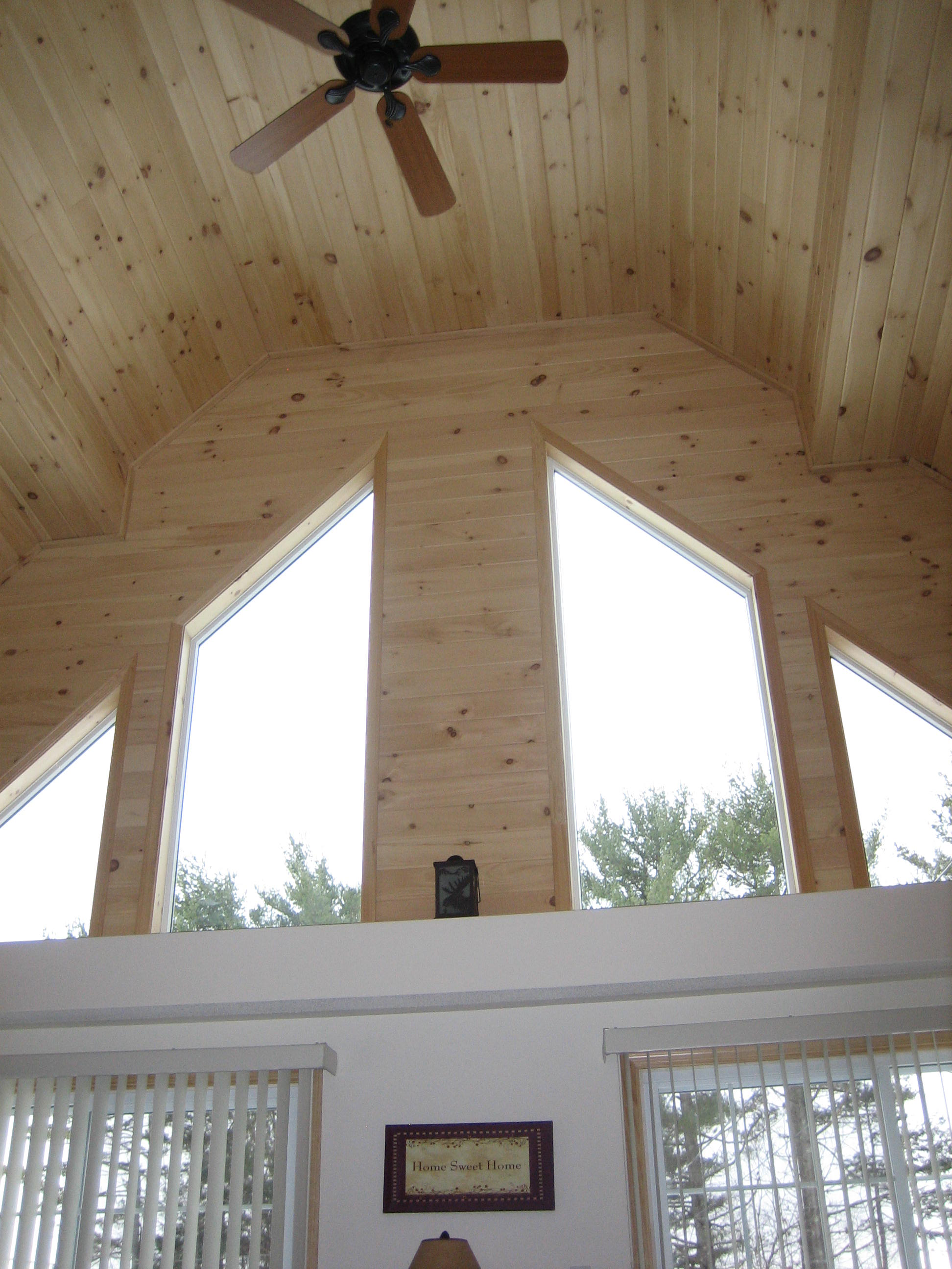 Thompson vaulted ceiling with ceiling fan and gable windows