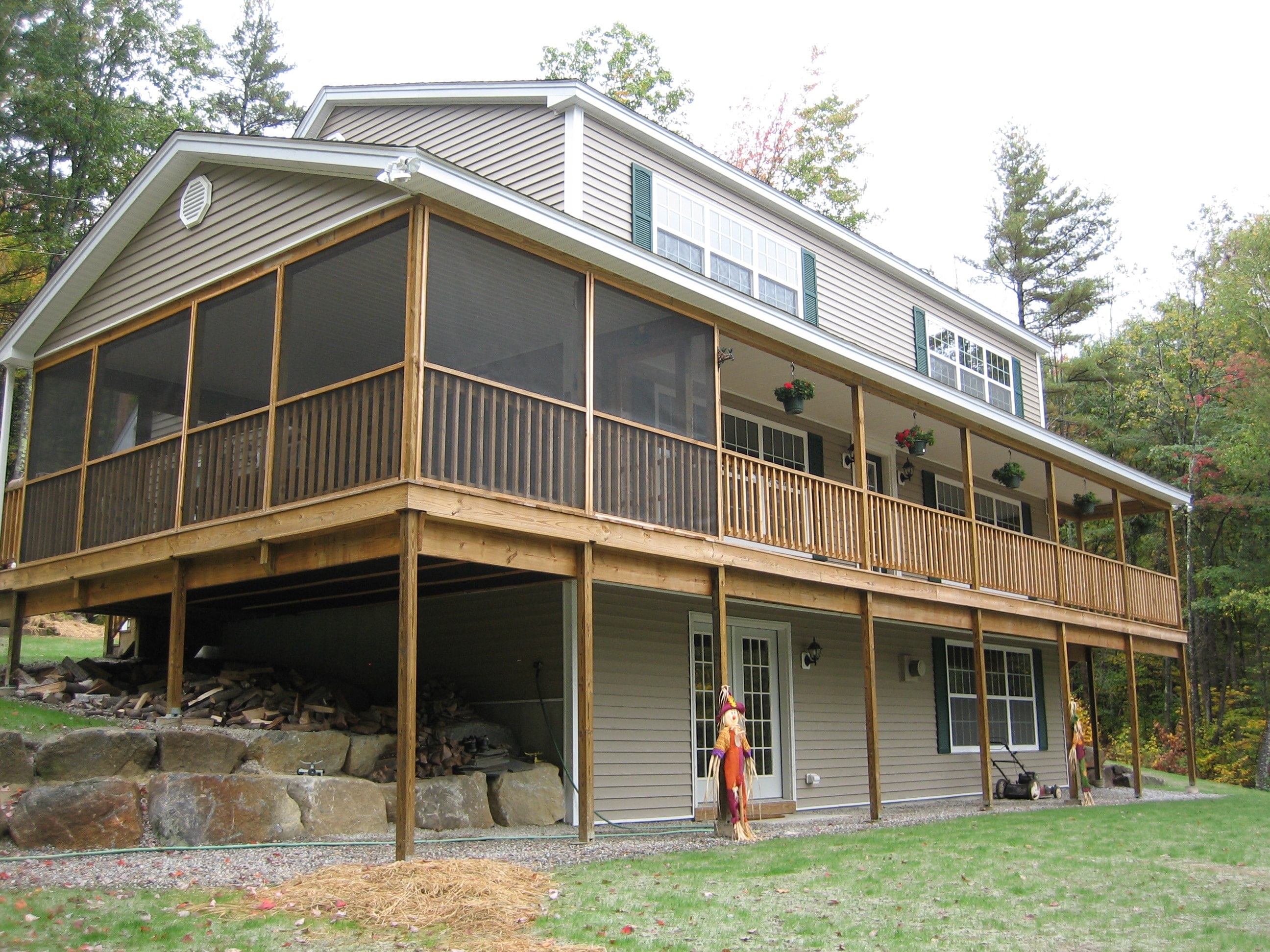 Westberg home with large screened porch and wrap-around deck