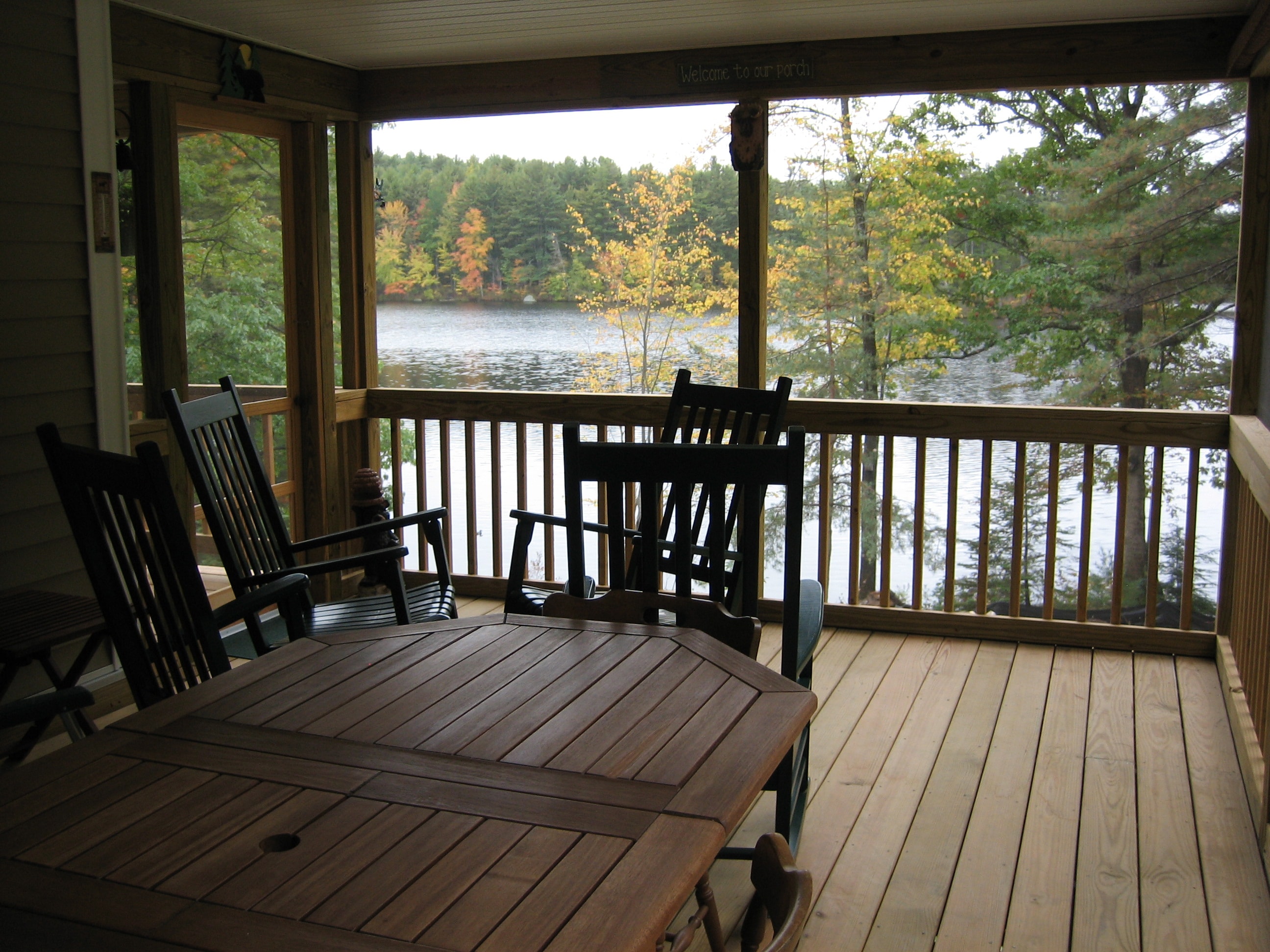Westberg screened porch interior overlooking lake in autumn