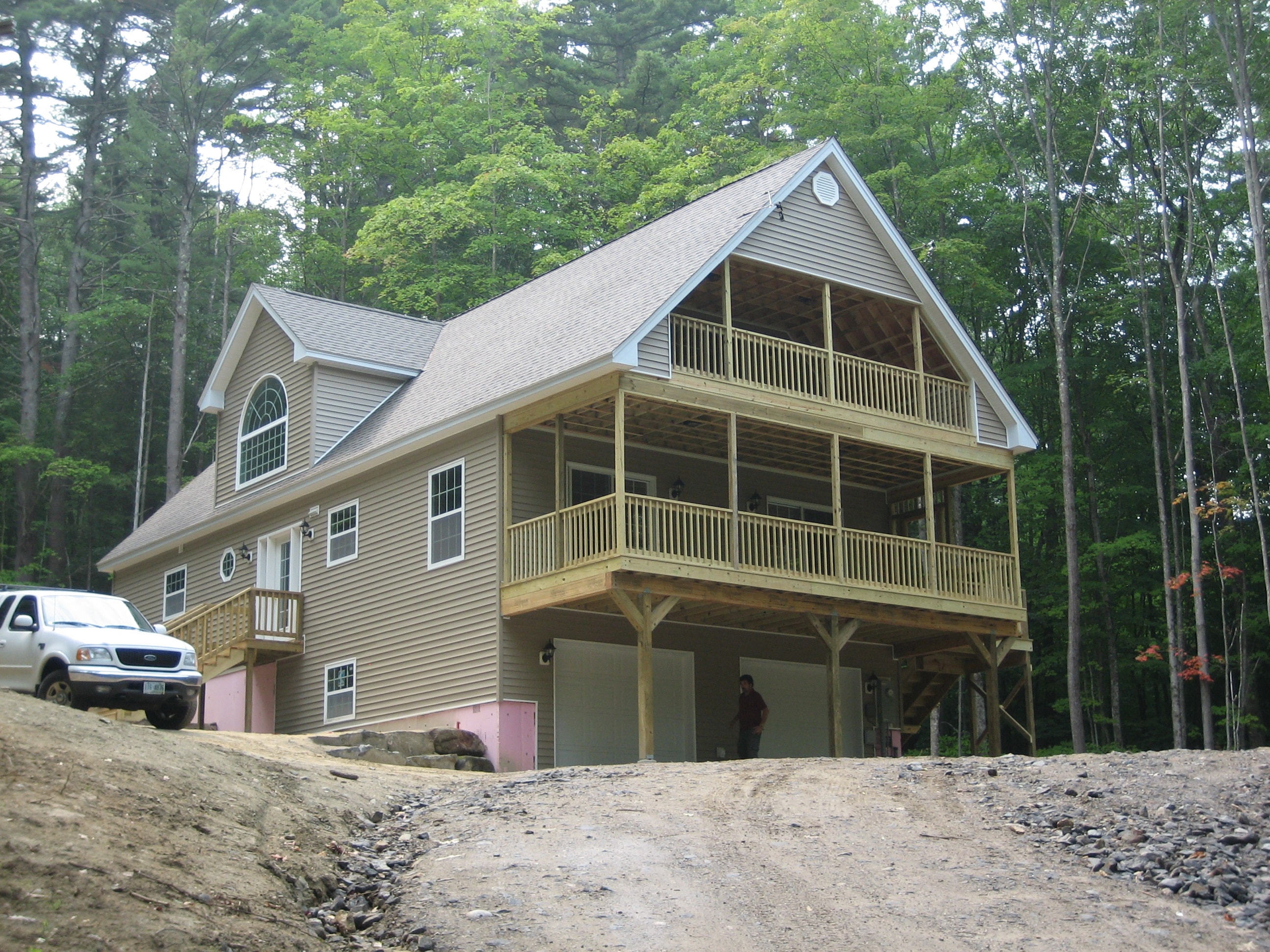 Zink home exterior with screened porch and elevated deck