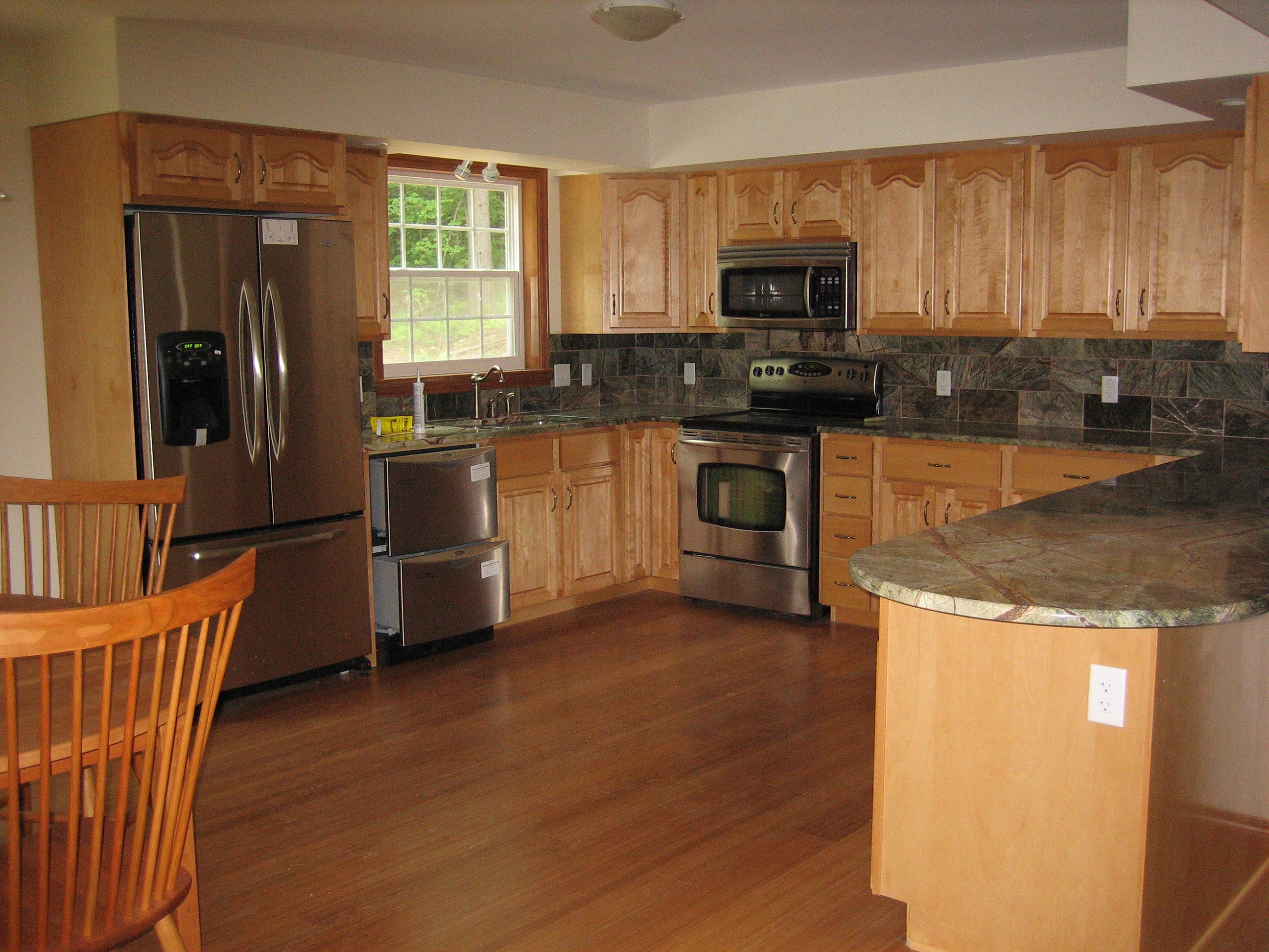 Zink custom kitchen with maple cabinets and granite countertops